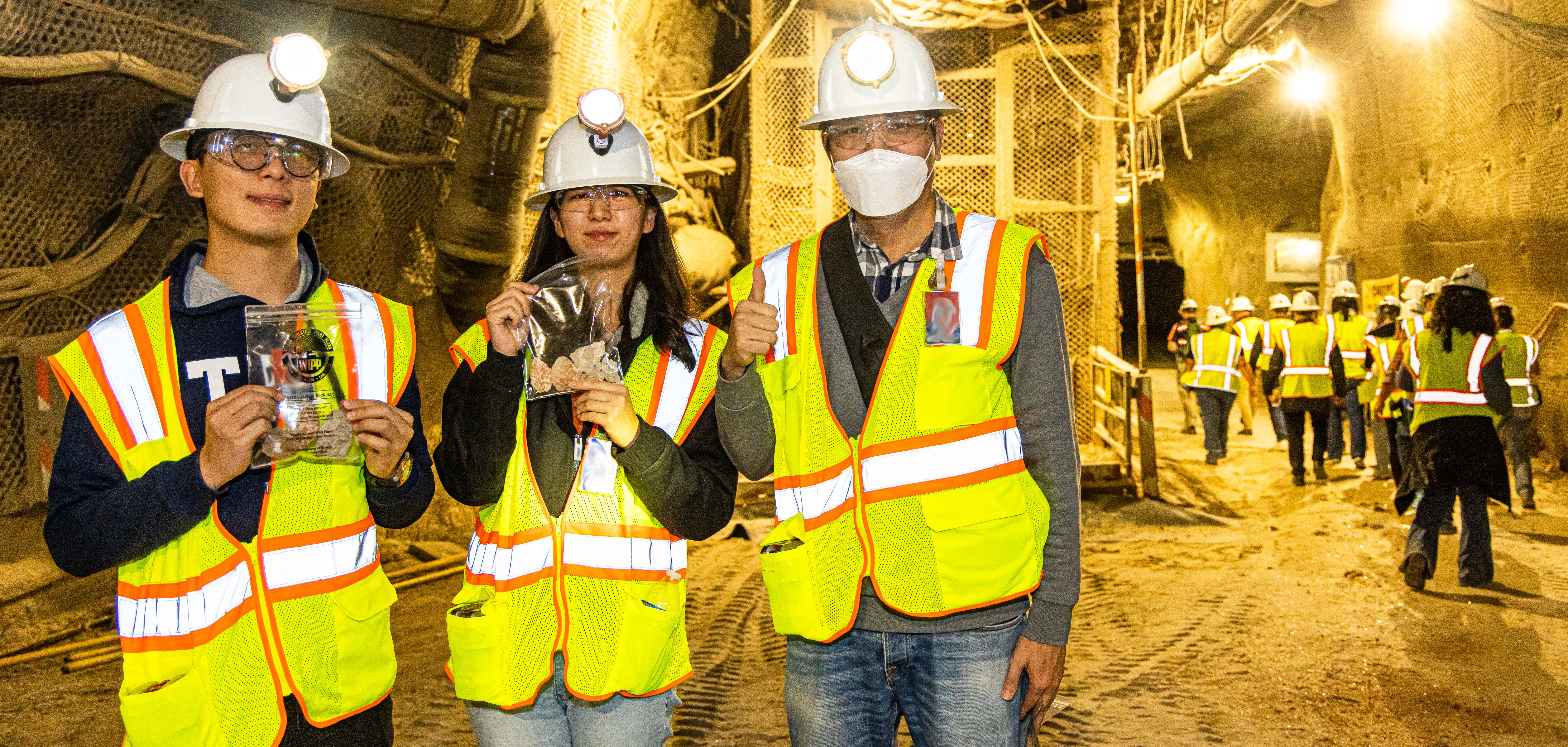 Scientists showing off the salt rocks they received on their tour
